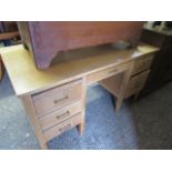 Light oak double pedestal desk with 6 drawers