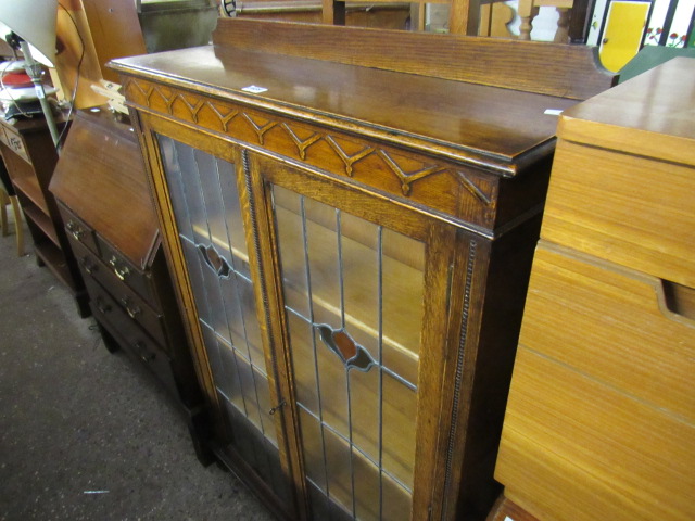 Oak glazed bookcase with leaded decorative glazed panels