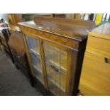 Oak glazed bookcase with leaded decorative glazed panels