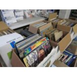 (2397) Tabletop of boxes of LP records