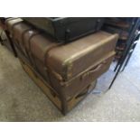 2 vintage trunks with metal bound corners