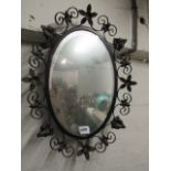 Wrought iron vine decorated mirror