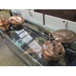 2 copper kettles and 2 copper bed warming pans with wooden handles