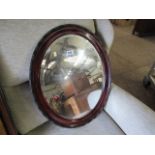 Mahogany oval framed mirror