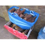 Crate and bag containing chopped logs with log rack