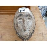 Painted and carved African mask