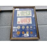 Framed and glazed wall hanging with British coins and bank notes