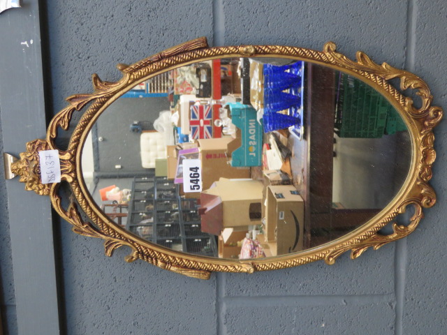 Oval mirror in metal frame