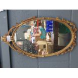 Oval mirror in metal frame