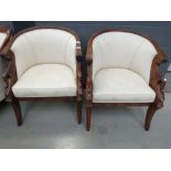 Pair of carved tub chairs in cream floral fabric