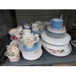 Cage containing a mixture of crockery to include teapot, milk jugs, sideplates and dinner plates