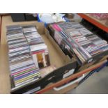 2 boxes containing CD's