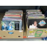 2 boxes containing vinyl records