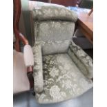 Victorian armchair in green floral fabric