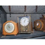 Cage containing a quantity of mantle clocks