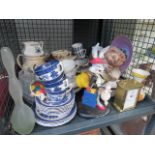 Cage containing a quartz mantle clock, cups and saucers, a figure entitled 'Shopaholic', general