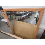 Pair of bevelled mirrors in oak frames