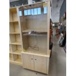 Maple finished display cabinet with glazed doors