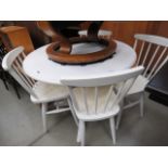 Circular white painted table with 4 stick back chairs