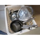 Box containing kitchen pots and pans
