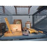 Cage containing mantle clocks, barometer, cigar box and ink blotters