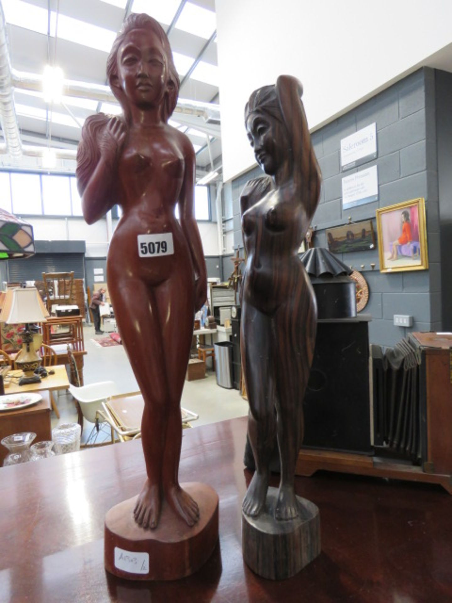2 carved wooden nudes