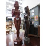 2 carved wooden nudes