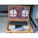 Picnic hamper with a carving set and cameras