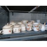 Cage containing a quantity of floral patterned Denby crockery