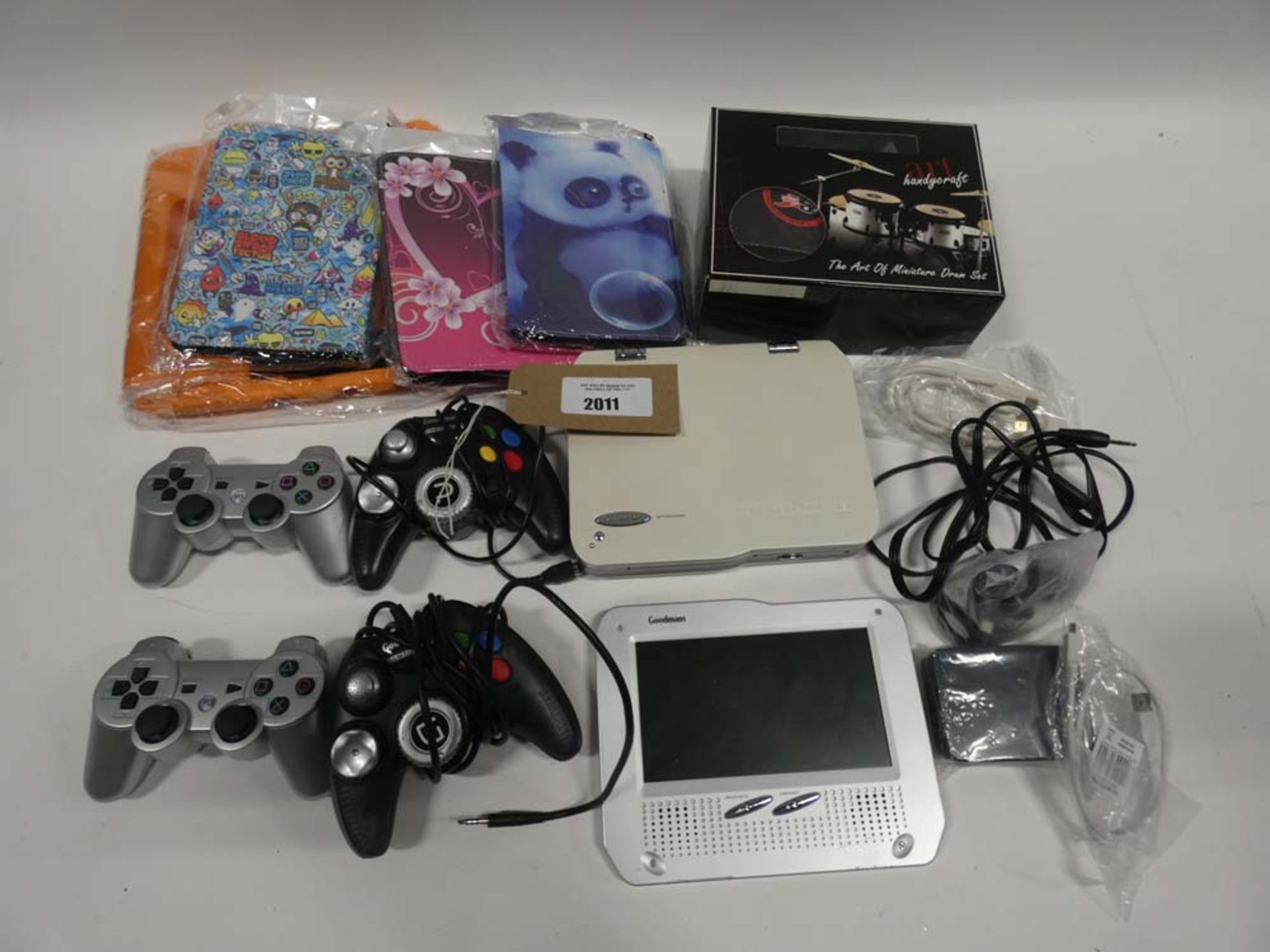 Bag containing portable DVD player, Goodmans Game & Play controllers, tablet cases etc