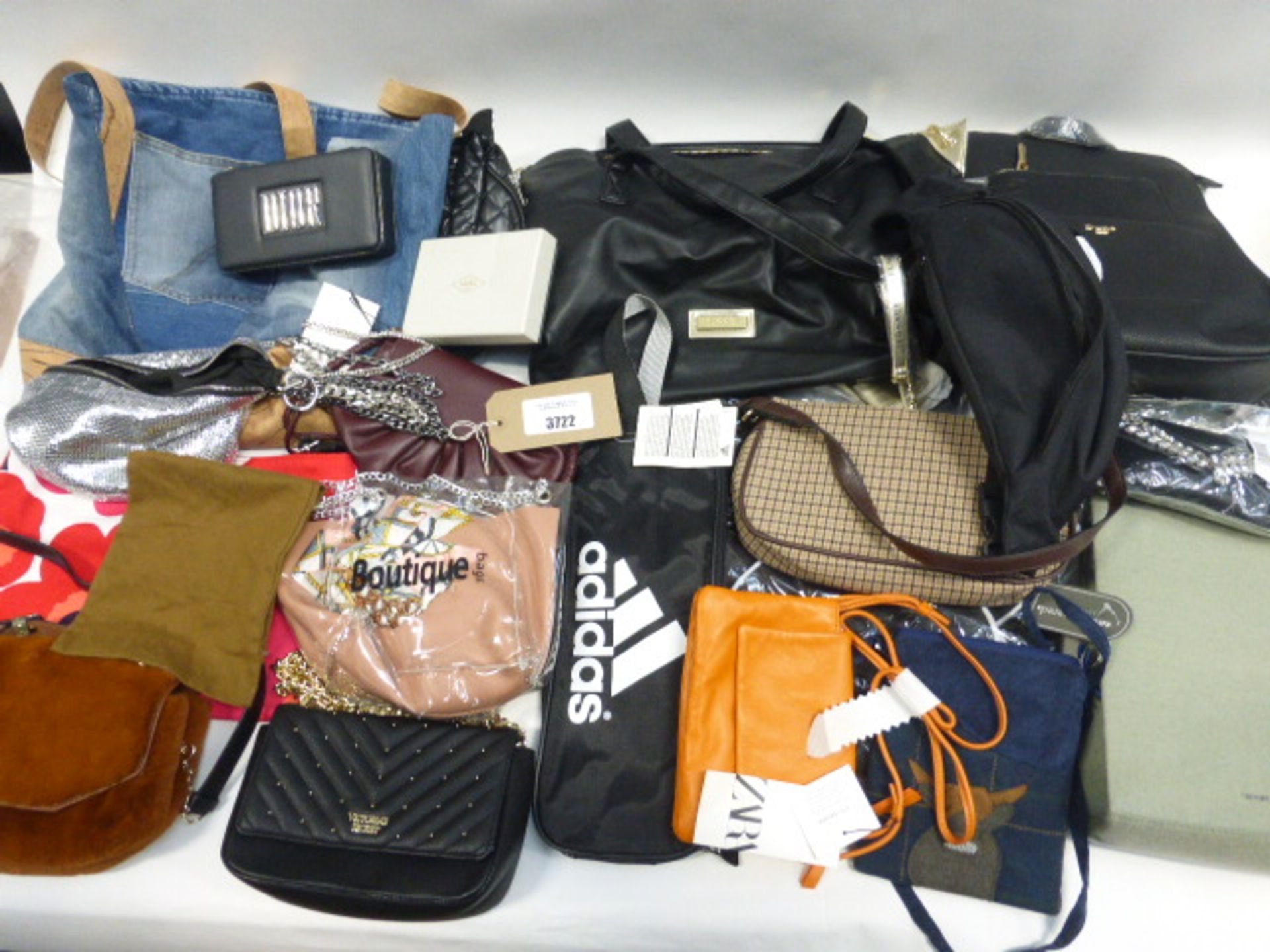 Large bag containing hand bags, ruck sacks, purses and wallets in various sizes