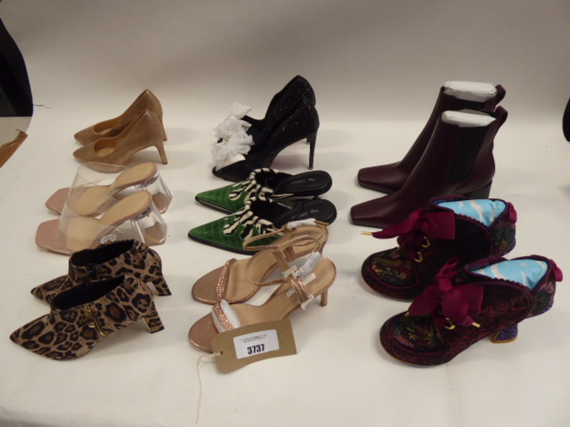 Bag of assorted heels and platform shoes