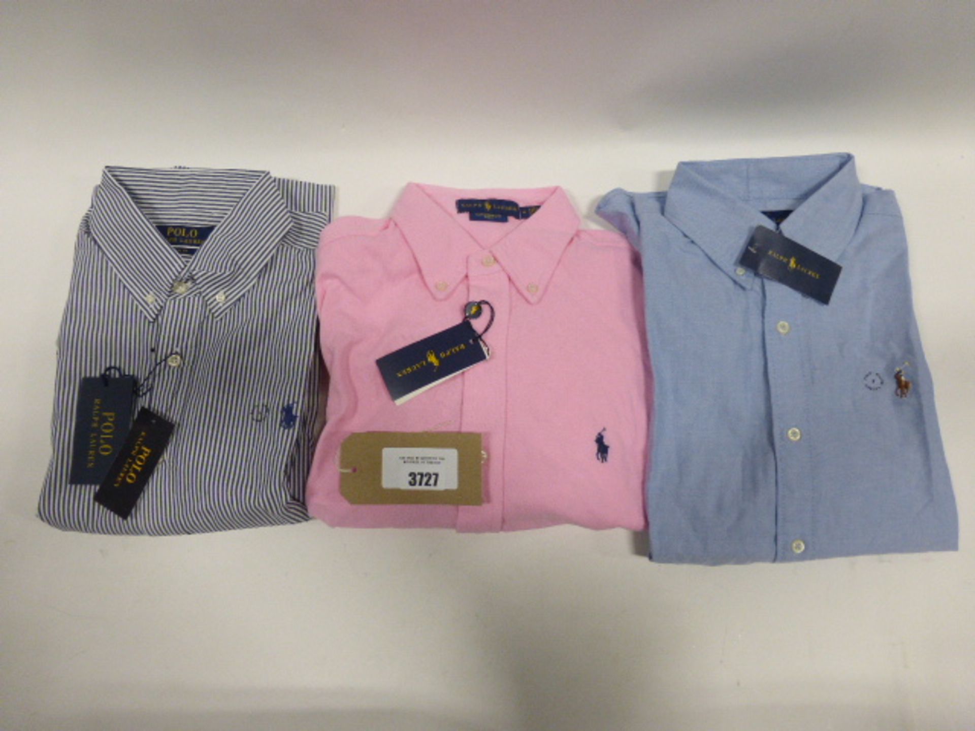 Three Polo Ralph Lauren Shirts blue size small, pink size medium and striped size large