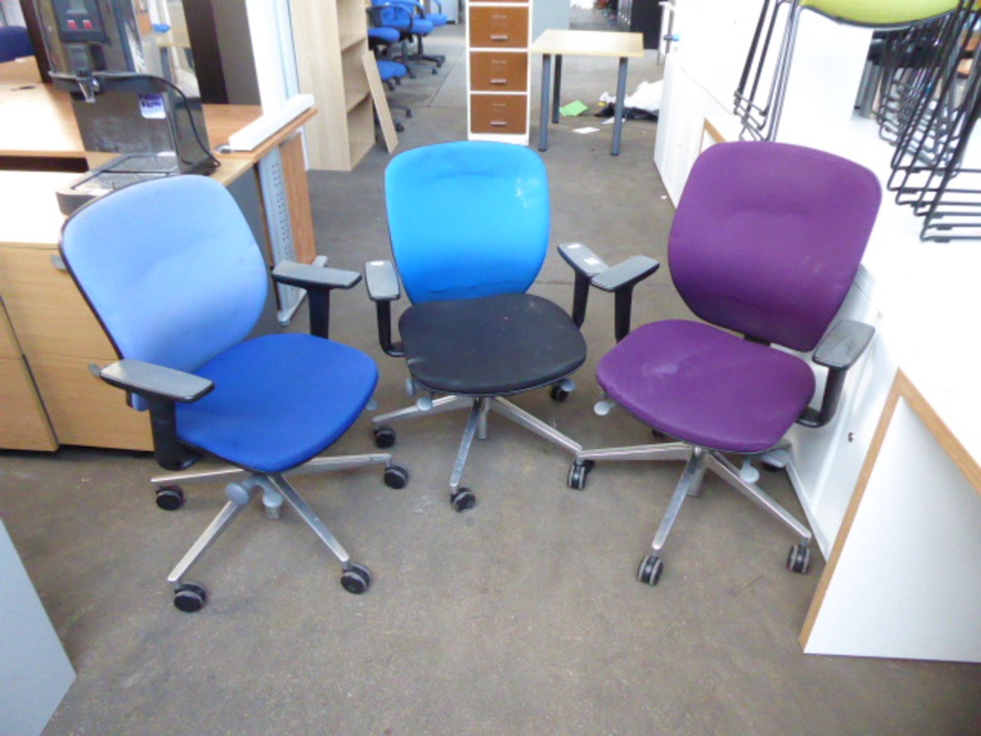 A set of 6 orange box colourful swivel armchairs on chrome bases