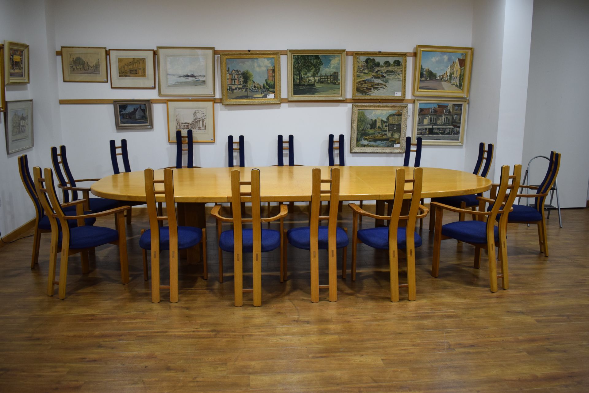 A 1983 conference suite in sweet chestnut including a twin pedestal table, 382 x 177 cm,