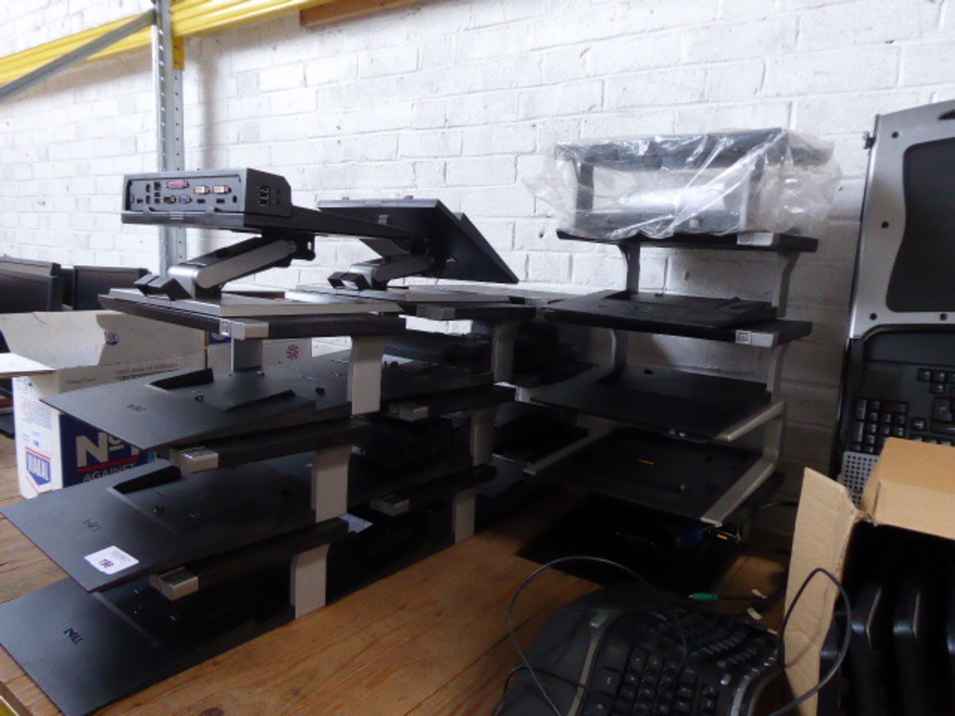 Approx. 15 Dell laptop docking stations, a power edge rack control console 15FT and a box of