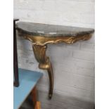 Gilt console table with black marble effect surface