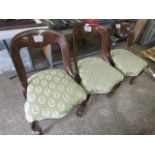 3 green floral upholstered dining chairs on bent wood frames