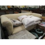 Beige upholstered Chesterfield style sofa