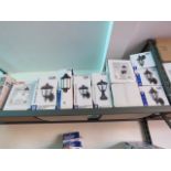 Shelf containing boxed outdoor LED coach lantern wall lights in mixed sizes