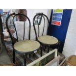 Pair of circular cane seated chairs