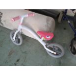 Childs balance bike in pink and white