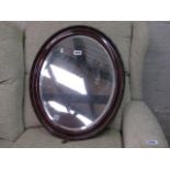 (2212) Oval framed and bevelled wall mirror