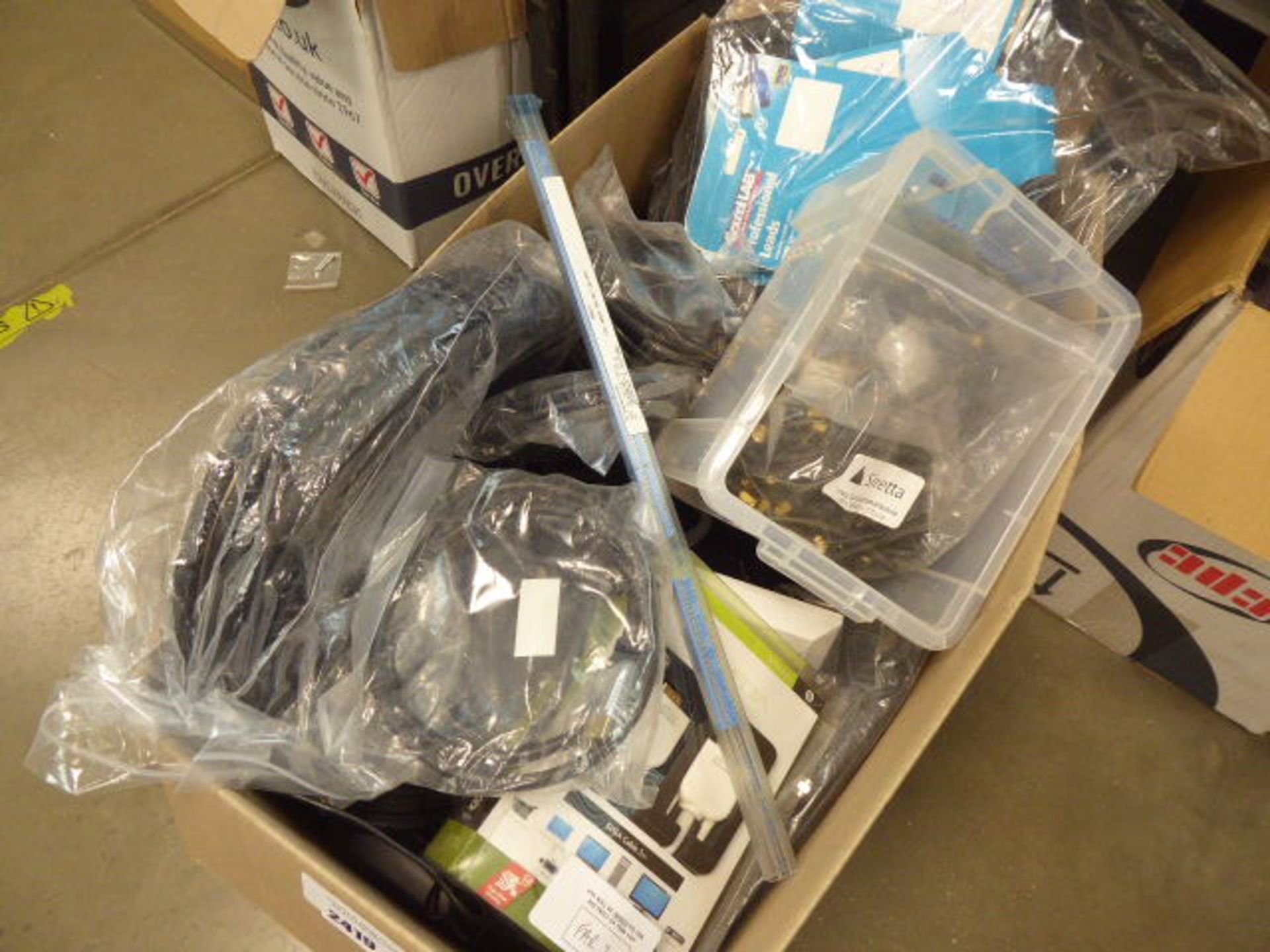Box containing various AV cables to include HDMI cables, VGA cables, extensions, etc