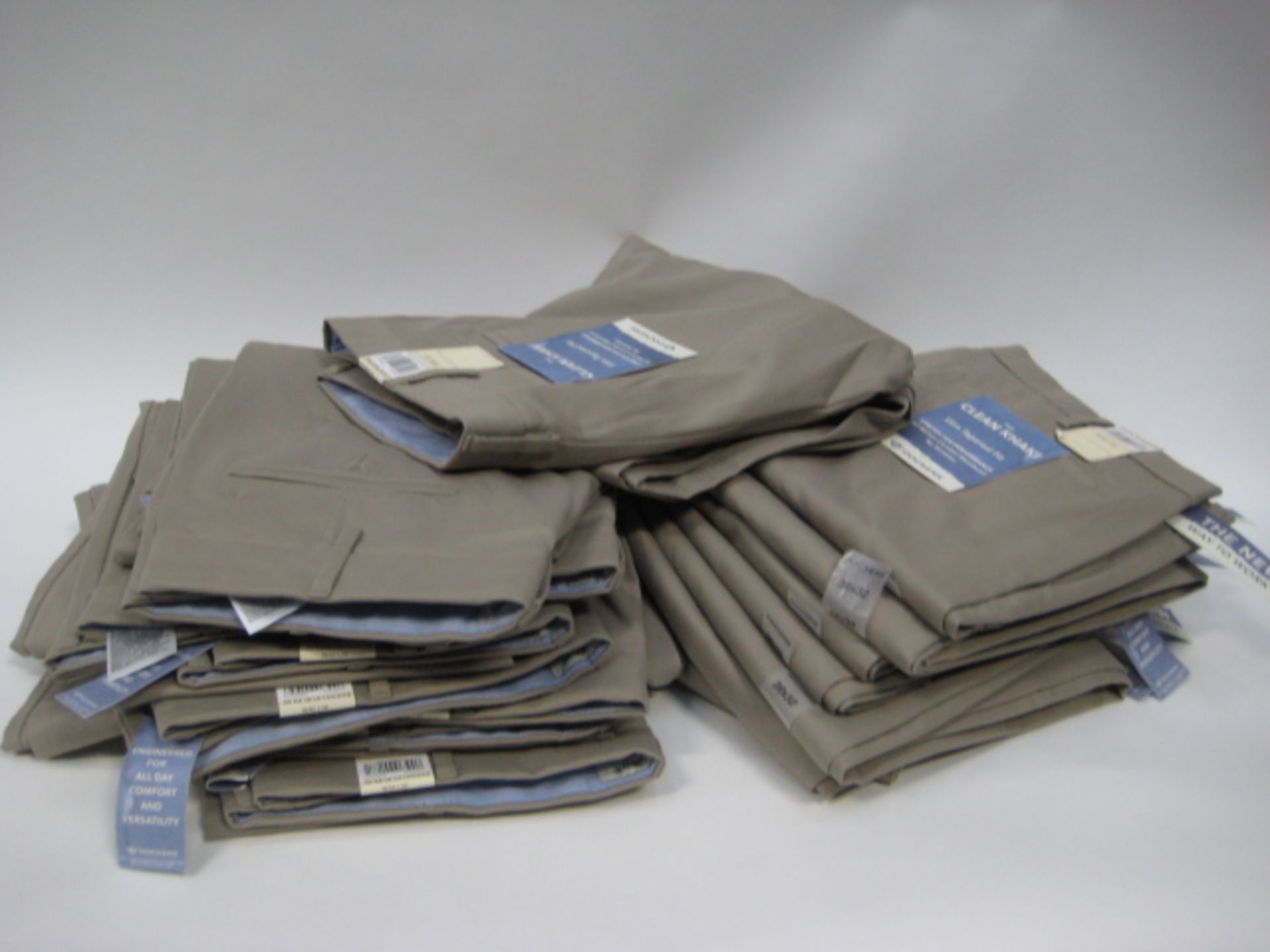 Bag containing 15 pairs of Soccer Khaki gents trousers size ranging from 32'' waist - 40'' waist -