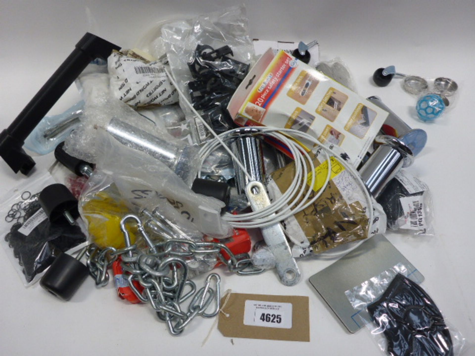 Bag containing furniture feet, first step safety starter sets, O-rings, castors, clips, and