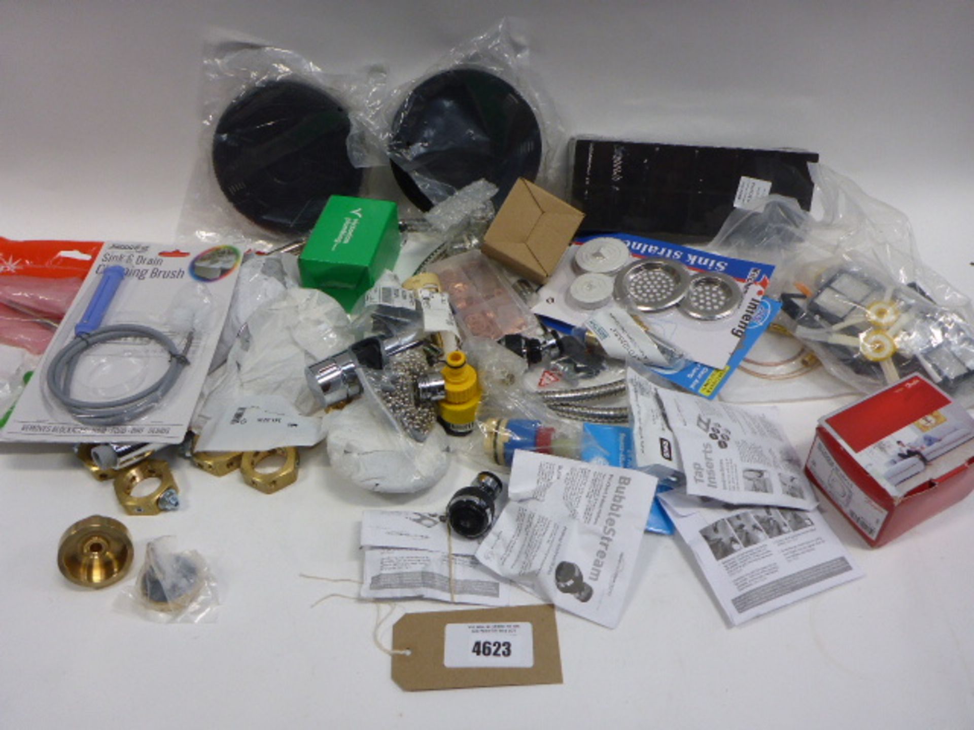 Bag containing sink drainer, shower hose, shower head, brass files, thermostat, filters, sink