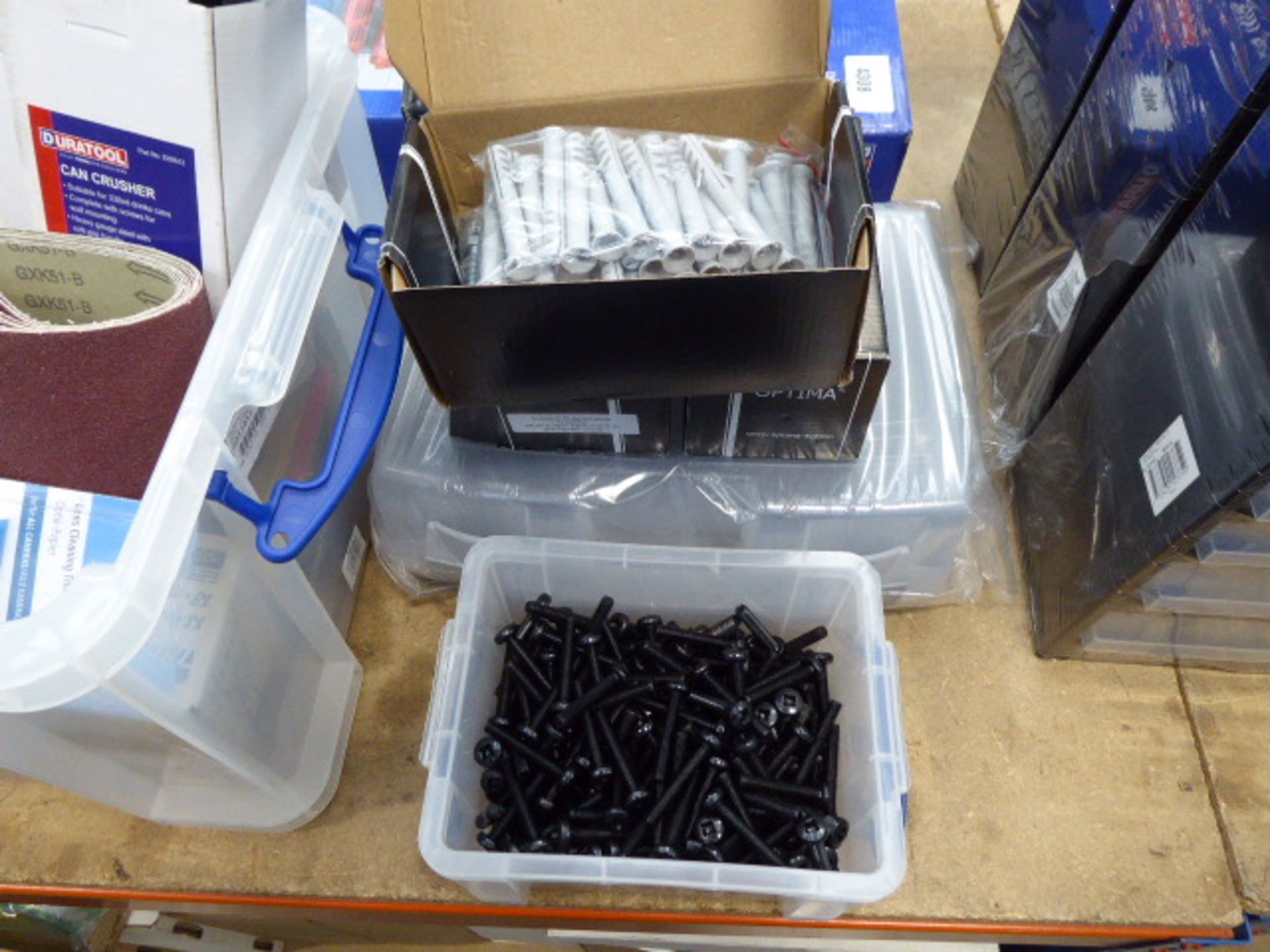 4 boxes of satellite TV aerial fixings, box of black bolts and a plastic container
