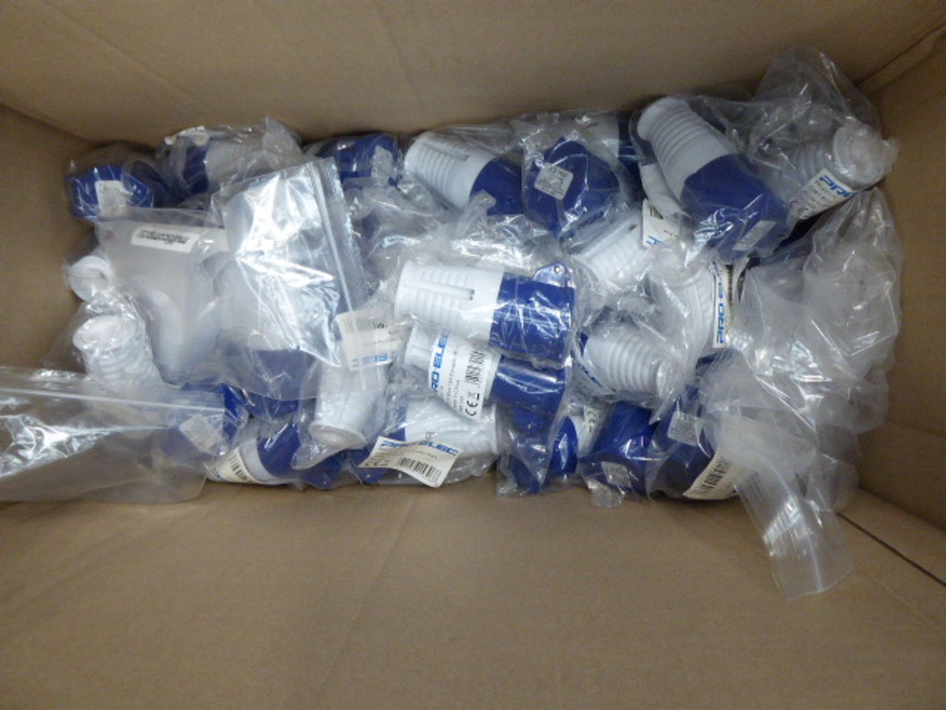 Box of blue 16 amp electric couplers