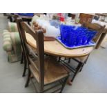 5131 - A circular pine table plus 4 beech rush seated chairs